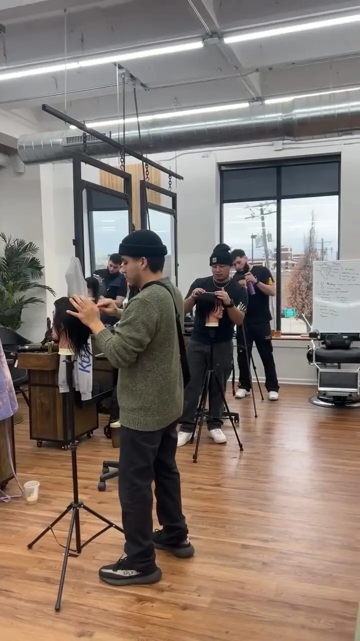 One-day hands-on course: barbers working through cuts on mannequins.