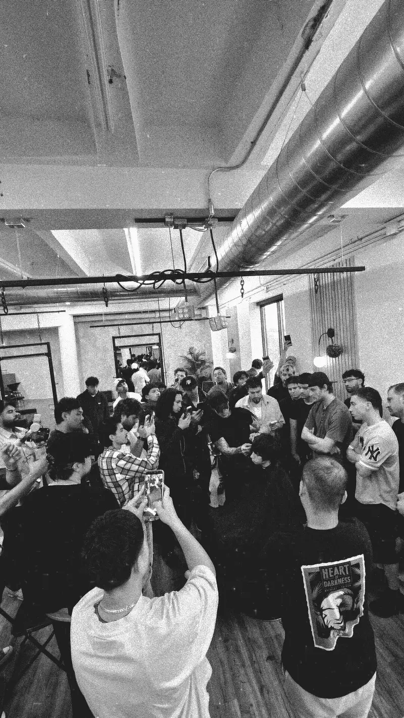 Barbers filming a live cut in the Elmhurst loft